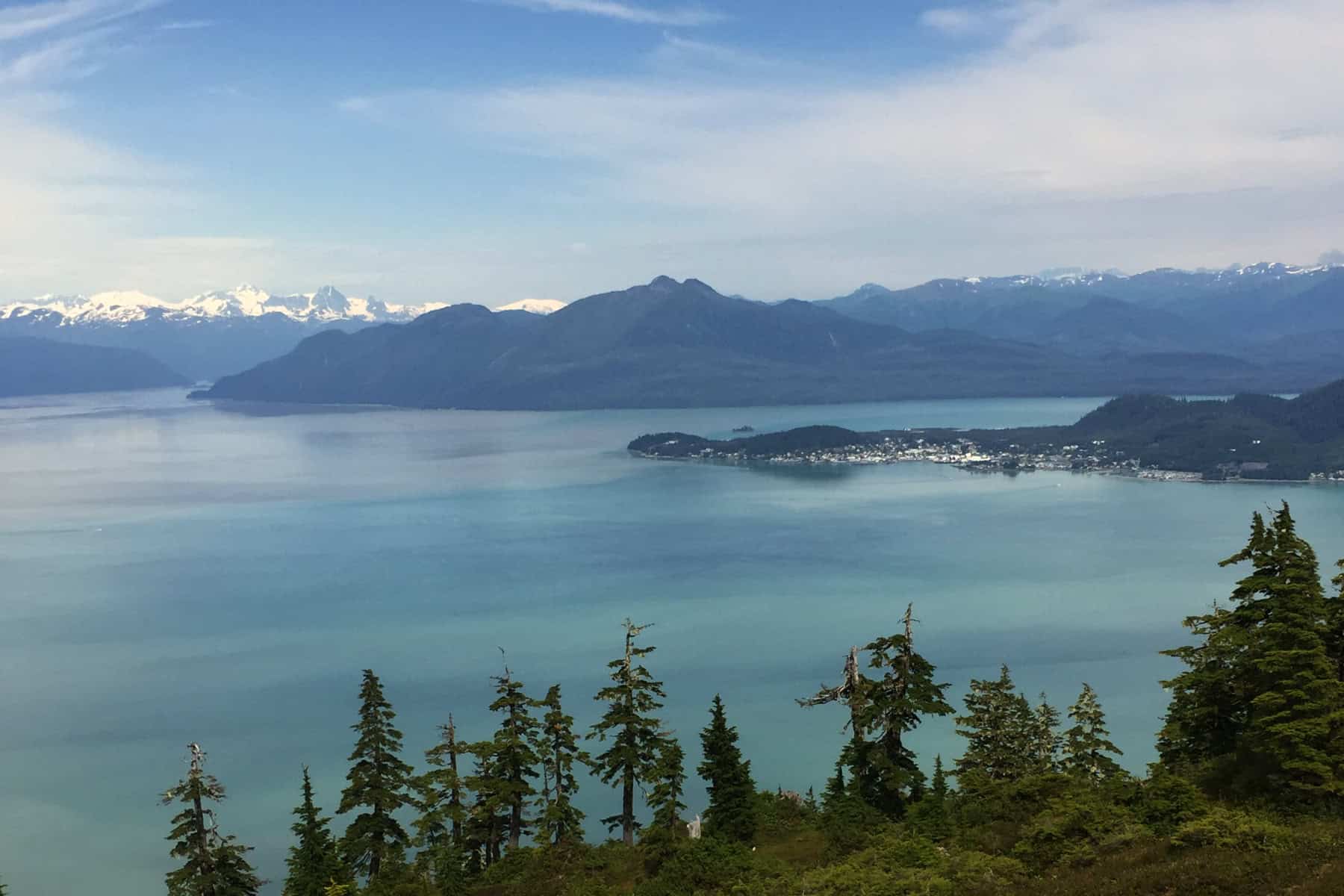 Aerial view of Wrangell, Alaska with downtown waterfront, Stikine river delta, and surrounding mountains