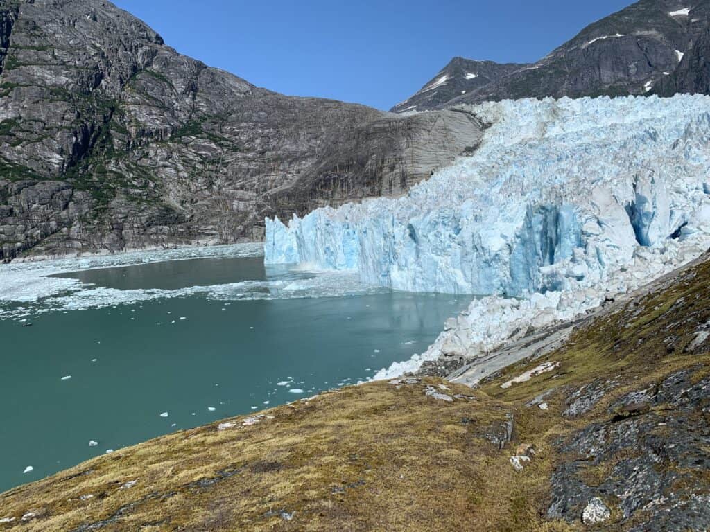 LeConte Glacier near Wrangell, Alaska, with fresh ice from a recent calving event floating in the fjord.