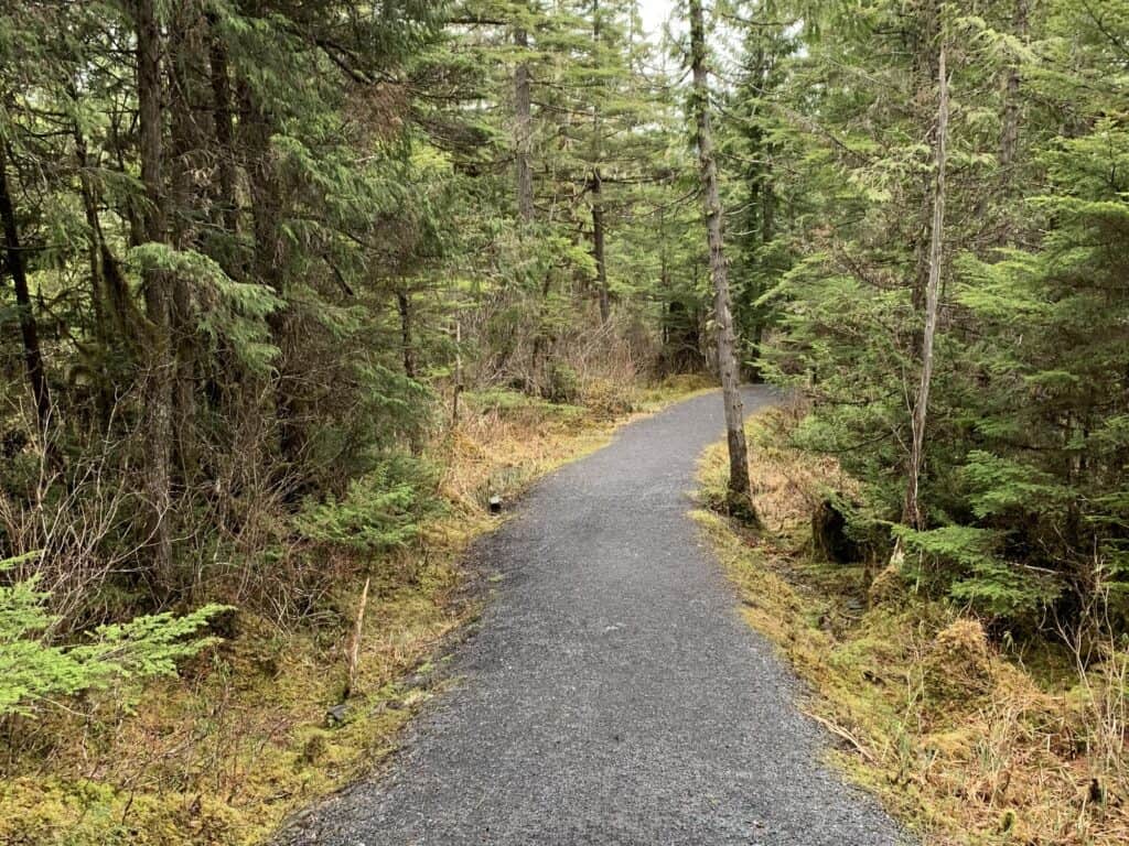 Gravel trail through the forest at Volunteer Park in Wrangell, Alaska.